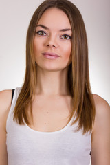 Portrait of a beautiful young woman in a white T-shirt