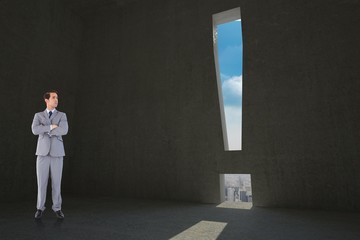 Obraz premium Composite image of serious businessman with arms crossed