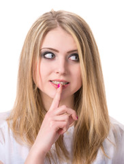 Fototapeta premium Young woman with finger on lips