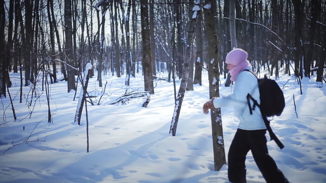 Lonely Woman Snowshoeing in nature