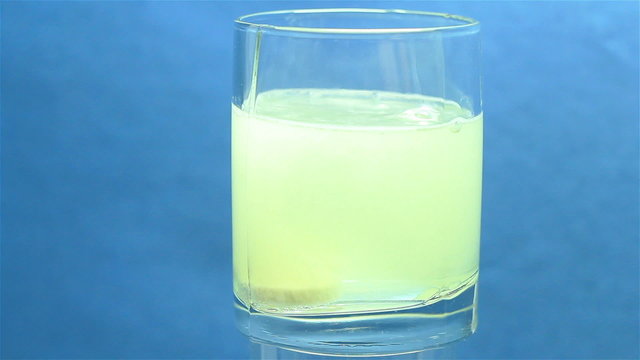 effervescent medicine in a glass of water
