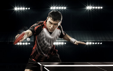 sports man tennis-player on black background - obrazy, fototapety, plakaty