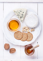 Camembert cheese and blue cheese with honey and nuts.