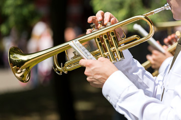 Fototapeta na wymiar Musician blowing trumpet