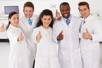 Fototapeta na wymiar Portrait Of Laboratory Technicians Standing In Group