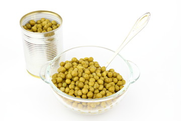 The peas in glass dish on the white background