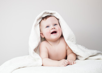 laughing baby on sofa, Beautiful smiling cute baby, newborn - 61329920