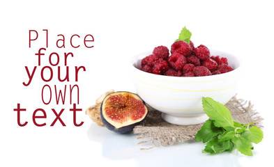 Raspberries in small bowl on sackcloth isolated on white