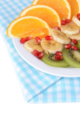 Sweet fresh fruits on plate on table close-up