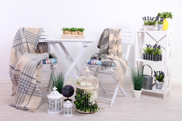 Garden chairs and table with flowers
