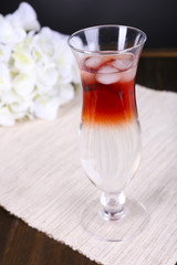 Glass of cocktail on table close-up
