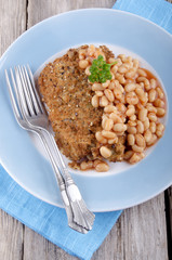cod fillet in bread crumbs with baked beans