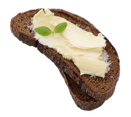 Slices of rye bread with butter, isolated on white