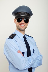 Portrait of smiling policemen in sunglasses