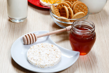 honey and white waffle on a table