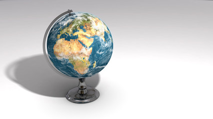 A realistic globe on a chrome pedestal over white C