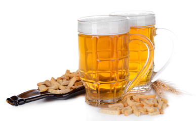 Glasses of beer with snack isolated on white