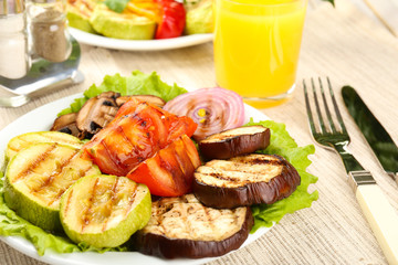 Delicious grilled vegetables on plate on table close-up