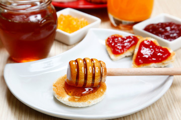 waffle with honey and jam on a dish