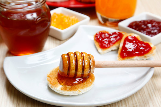 waffle with honey and jam on a dish
