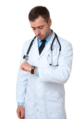Fototapeta premium Mature male doctor checking time isolated on white background. S