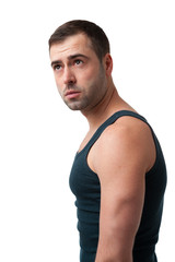 Mature man in t-shirt looking up on white background