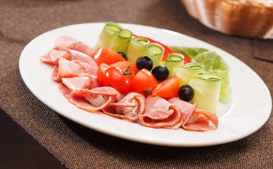 Meat appetizer with vegetables