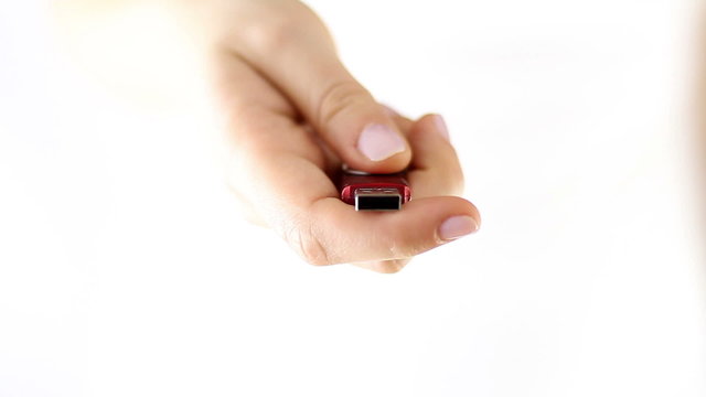 Hands Offering a usb memory stick