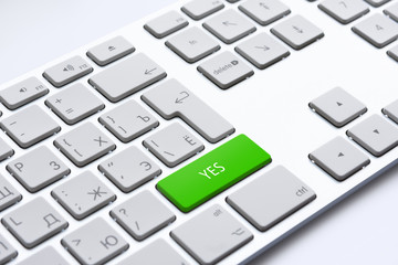 Close up of a keyboard with green YES key