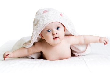 happy baby girl in towel
