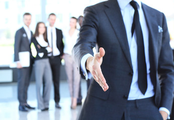 A business man with an open hand ready to seal a deal 