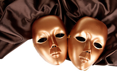 Mask on brown fabric on white background