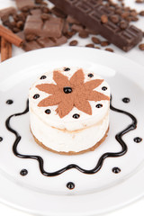 Sweet cake with chocolate on plate close-up