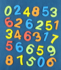 Colorful numbers on school desk background