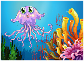 Obraz na płótnie Canvas A cute jellyfish near the coral reefs