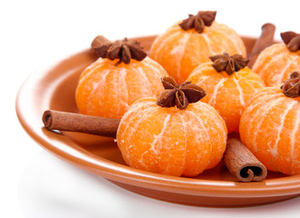 Ripe sweet tangerines and spices, isolated on white