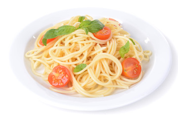 Delicious spaghetti with tomatoes on plate isolated on white