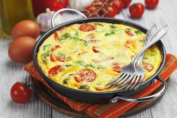 Omelet with vegetables and cheese. Frittata