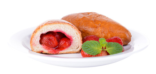 Fresh baked pasties with strawberries isolated on white