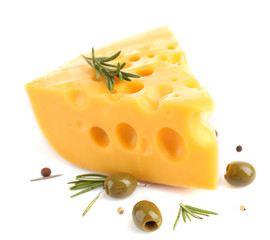 Piece of cheese with green olives, isolated on white