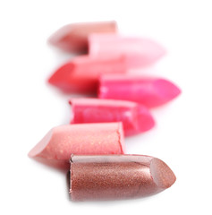 Several different lipsticks isolated on white