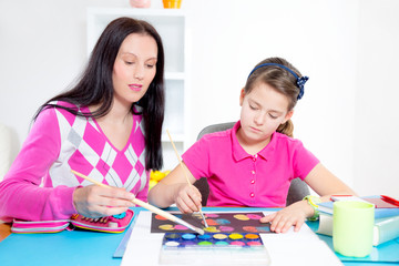 Mother and daughter painting.