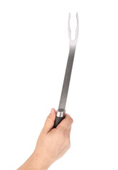 Hand holding bbq fork.