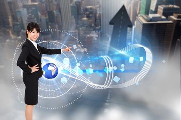 Composite image of smiling businesswoman pointing