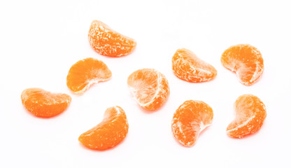 Fototapeta na wymiar Slices of tangerines isolated on a white