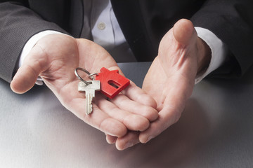 construction manager with house key in hands