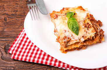 Tasty lasagna on white plate