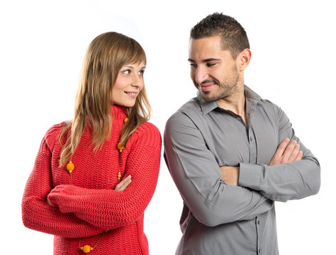 Couple with their arms crossed over isolated background