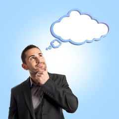 Businessman thinking over blue background