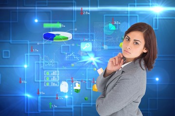 Composite image of focused businesswoman